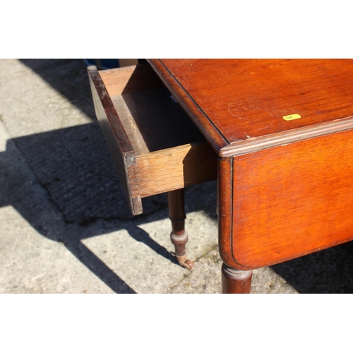 515 - A mahogany Pembroke table, fitted one drawer, on turned and castored supports, 35