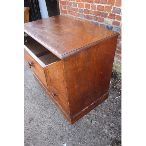 531 - A mahogany chest of three long drawers with knob handles, on block base, 36