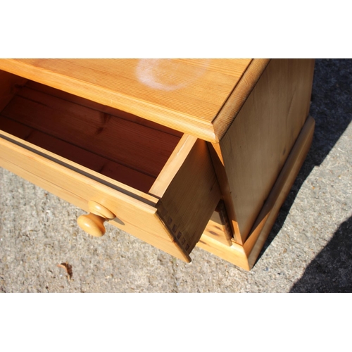 547 - A waxed pine chest of two long drawers, on block base, 26