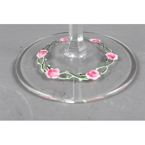 56 - An early 20th century Continental glass table service with enamelled pink cabbage rose decoration an... 