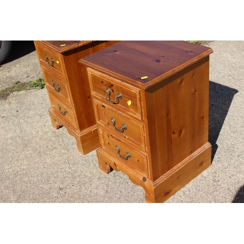 568 - A pair of pine bedside chests of three drawers, 16