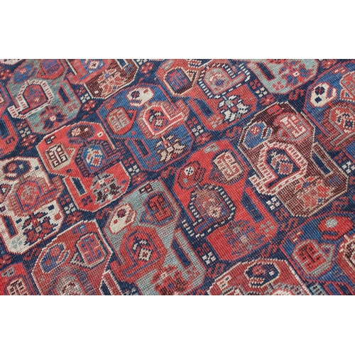 574 - A Caucasian tribal wool rug with stylised cypress tree and geometric designs with multi-guard border... 