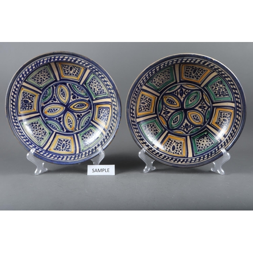 93 - Two matched tin glazed dishes with geometric decoration, 13 3/4