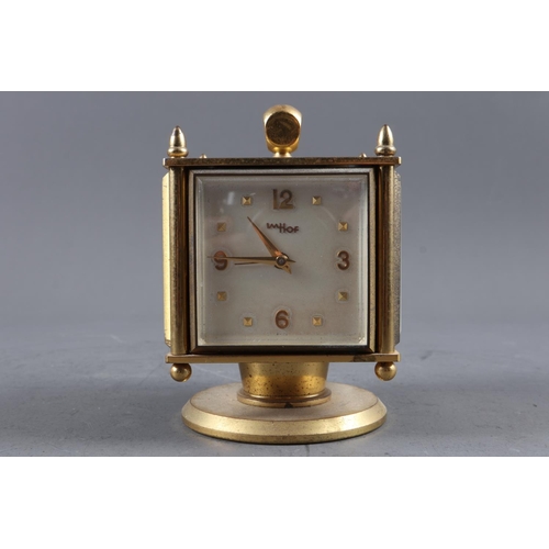 148 - An Imhof desk clock, barometer, thermometer, hygrometer, in brushed brass case, and four other clock... 