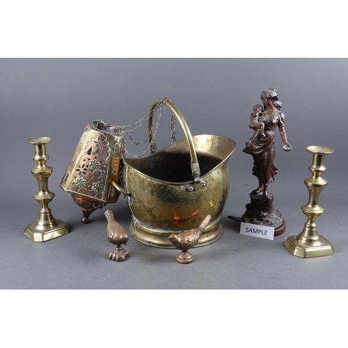 160 - A brass and copper hanging lantern with embossed and pierced decoration, 10 3/4