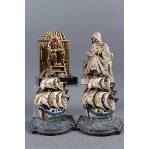 166 - A pair of cast iron galleon bookends, an old painted spelter bookend and one other