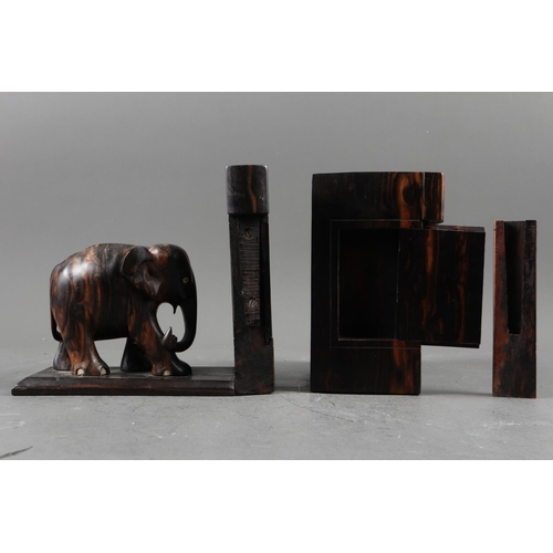 177 - A pair of carved calamander elephant bookends with hidden compartments and bone tusks, 6 1/2