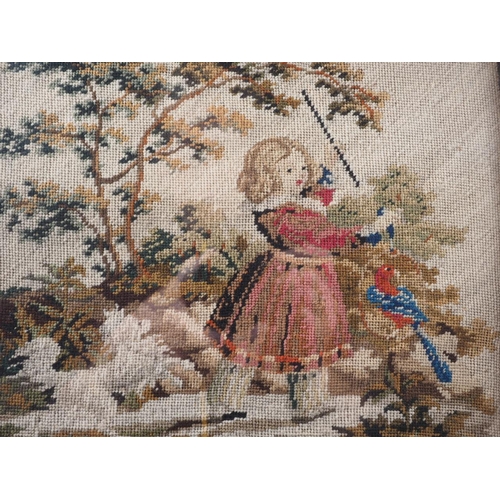 197 - A 19th century needlework picture of a girl with a dog and a parrot, in moulded frame, 13