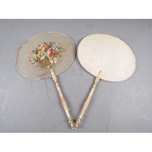 201 - A pair of 19th century floral embroidered fan with carved gilt wood handles