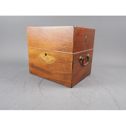 215 - A late Georgian mahogany and inlaid two-handle decanter box, containing six gilt decorated decanters... 