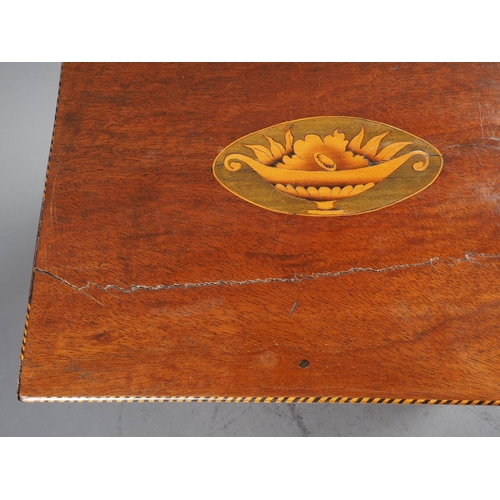 215 - A late Georgian mahogany and inlaid two-handle decanter box, containing six gilt decorated decanters... 