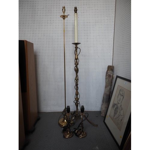 226 - A brass standard lamp, on tripod supports, 48 3/4