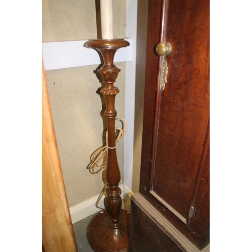 234 - A 1950s carved walnut standard lamp, on circular base, 54