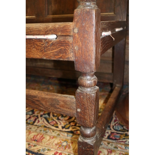 453 - A Liberty style oak framed reclining armchair with loose cushions upholstered in an old gold velvet