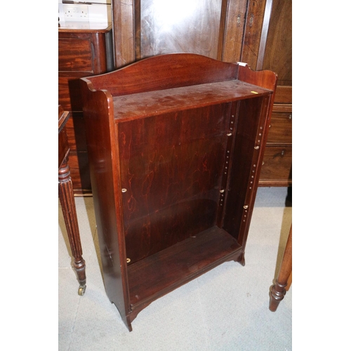 511 - An early 20th century carved walnut circular top two-tier occasional table, on panel supports, 18 1/... 