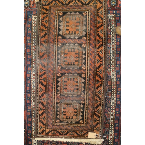 589 - A Herati rug with all-over design on a dark blue ground and triple bordered, in shades of red, blue ... 