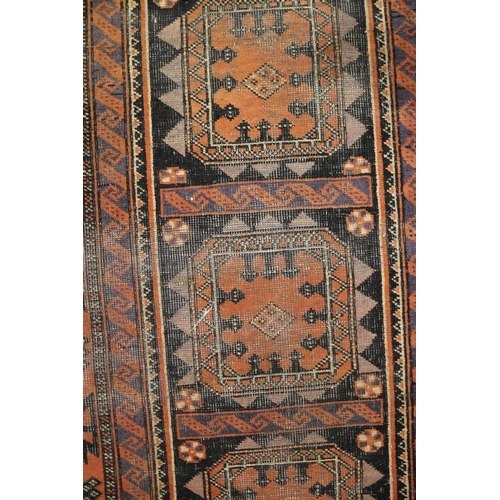 589 - A Herati rug with all-over design on a dark blue ground and triple bordered, in shades of red, blue ... 