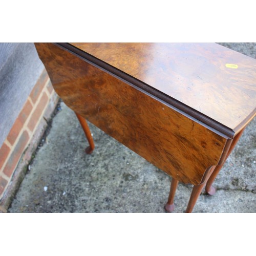 526 - A 1930s figured walnut shape top drop leaf occasional table, on cabriole supports and pad feet, 24