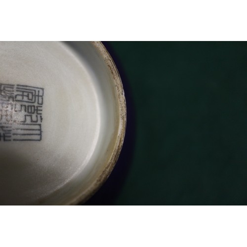 118 - A Chinese purple glazed bowl with seal mark to base, 5 1/2