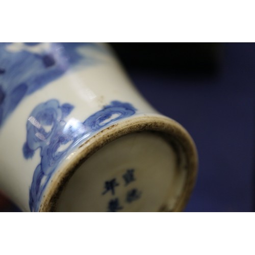 119 - A pair of Chinese blue and white gu vases with floral decoration and double ring marks to base, 10