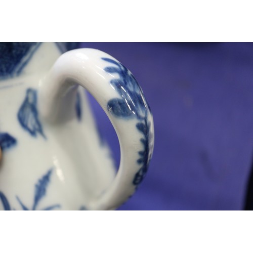 119 - A pair of Chinese blue and white gu vases with floral decoration and double ring marks to base, 10