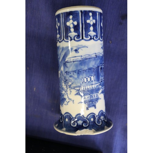 119 - A pair of Chinese blue and white gu vases with floral decoration and double ring marks to base, 10