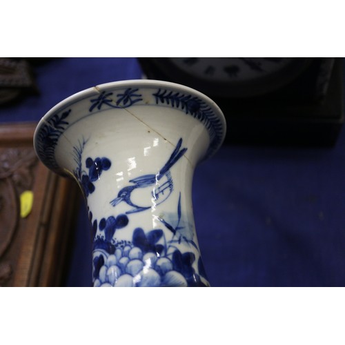 119 - A pair of Chinese blue and white gu vases with floral decoration and double ring marks to base, 10