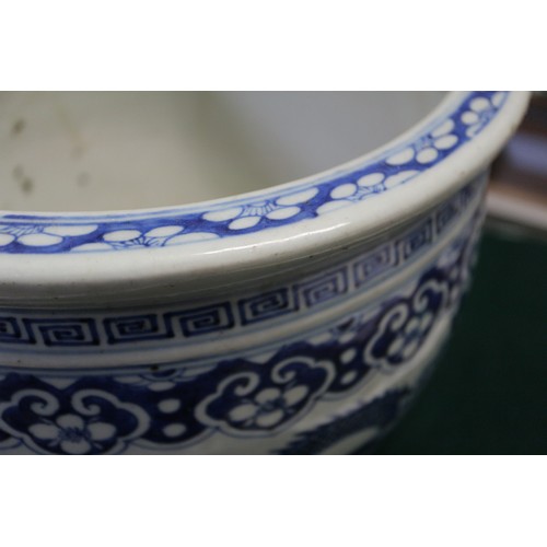 120 - A Chinese blue and white fish bowl with dragon and flower decoration, 10