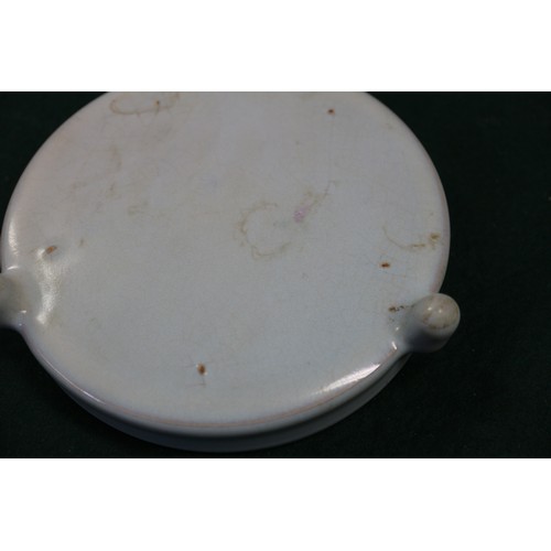 122 - A Chinese pale blue glazed dish with six-character mark to base, 4 1/2