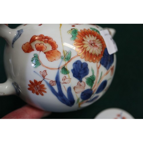 124 - A Chinese famille verte baluster vase with flower and leaf decoration, 7 3/4