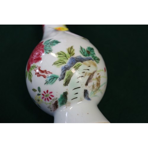 124 - A Chinese famille verte baluster vase with flower and leaf decoration, 7 3/4