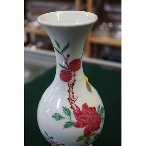 124 - A Chinese famille verte baluster vase with flower and leaf decoration, 7 3/4