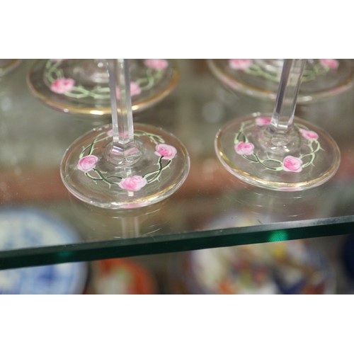 56 - An early 20th century Continental glass table service with enamelled pink cabbage rose decoration an... 