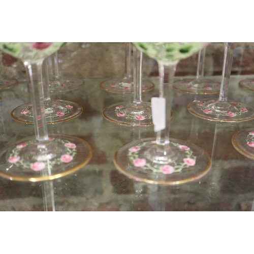 56 - An early 20th century Continental glass table service with enamelled pink cabbage rose decoration an... 