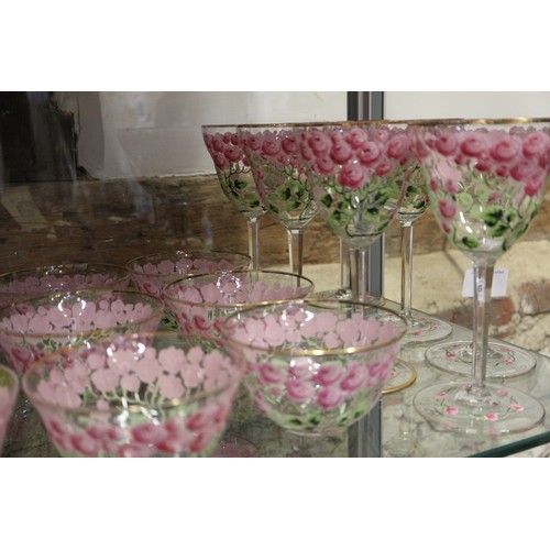 56 - An early 20th century Continental glass table service with enamelled pink cabbage rose decoration an... 