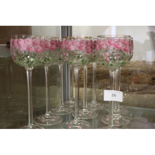 56 - An early 20th century Continental glass table service with enamelled pink cabbage rose decoration an... 