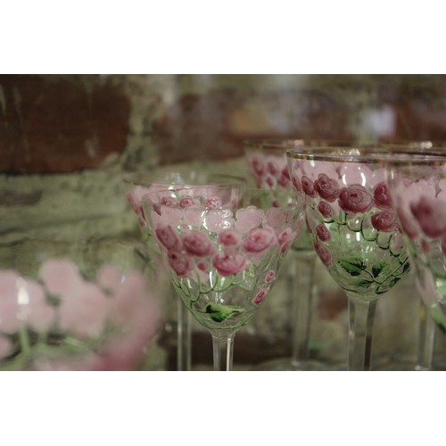 56 - An early 20th century Continental glass table service with enamelled pink cabbage rose decoration an... 