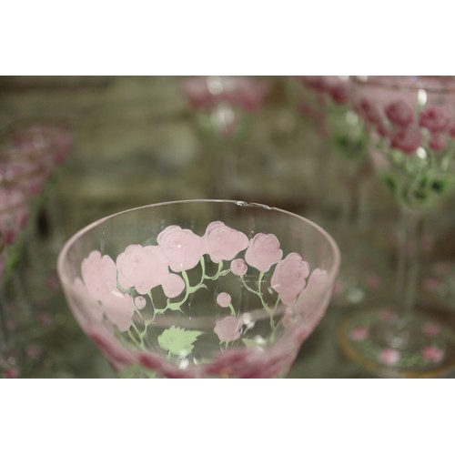 56 - An early 20th century Continental glass table service with enamelled pink cabbage rose decoration an... 