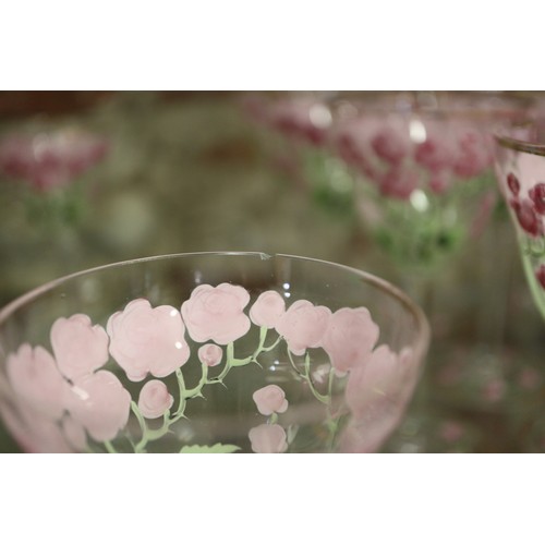 56 - An early 20th century Continental glass table service with enamelled pink cabbage rose decoration an... 