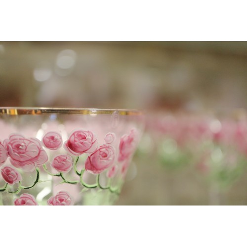 56 - An early 20th century Continental glass table service with enamelled pink cabbage rose decoration an... 