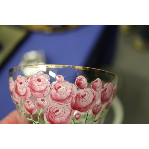 56 - An early 20th century Continental glass table service with enamelled pink cabbage rose decoration an... 