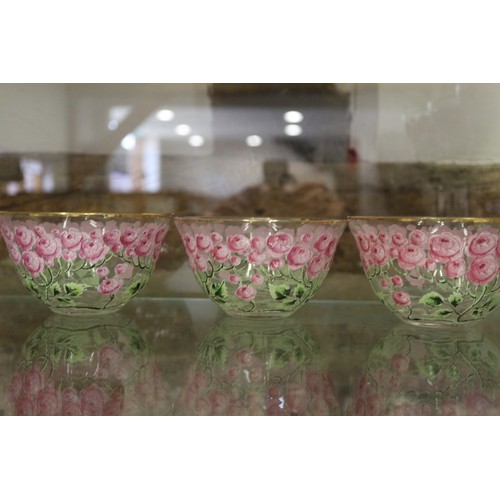 56 - An early 20th century Continental glass table service with enamelled pink cabbage rose decoration an... 