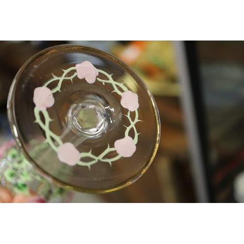 56 - An early 20th century Continental glass table service with enamelled pink cabbage rose decoration an... 