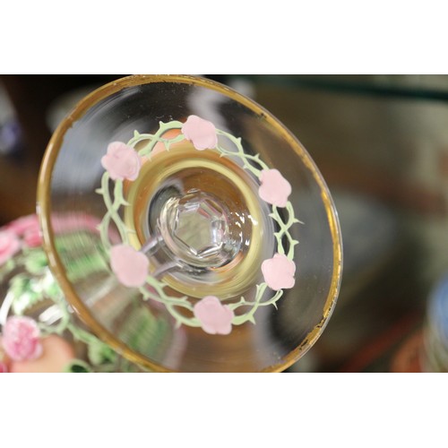 56 - An early 20th century Continental glass table service with enamelled pink cabbage rose decoration an... 