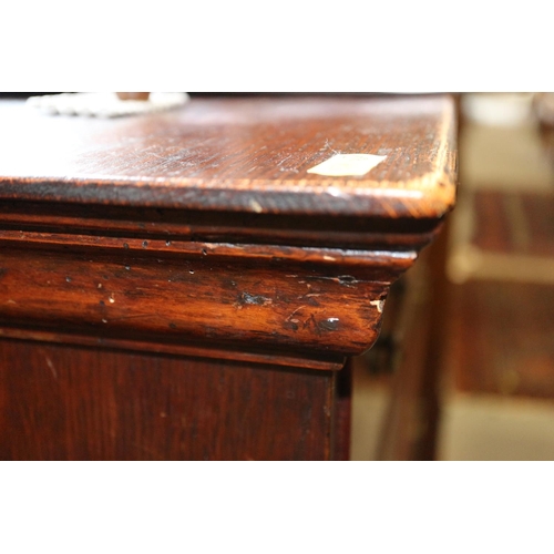 425 - A figured walnut and feather banded chest of two short and three long graduated drawers, on bun feet... 