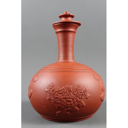 25 - A 19th century red ware carafe and cover with sprigged Phoenix and floral decoration, 9