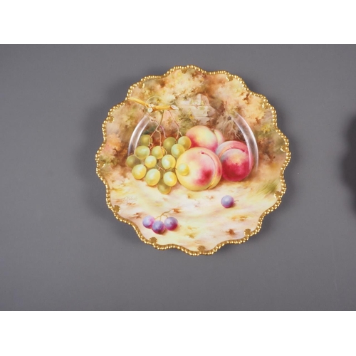 42 - A pair of Royal Worcester dessert plates with peach and grape decoration, by F Roberts, 8 3/4