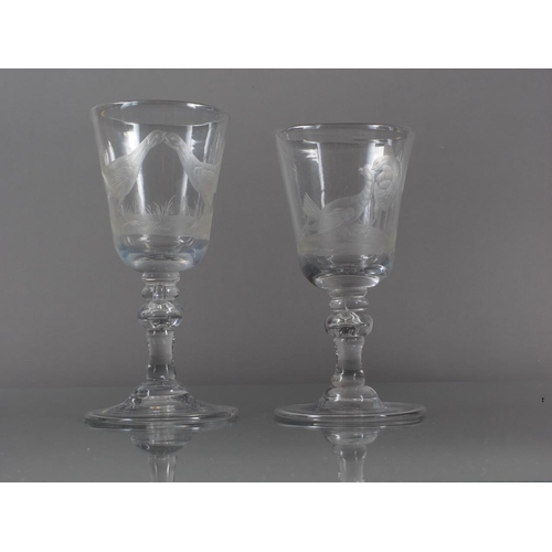 64 - Two wine glasses with light knopped tear drop stems, engraved with game birds, on folded feet, 6 1/2... 