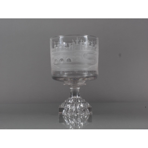 68 - An early 19th century goblet wheel engraved with Alnwick Castle Northumberland and monogram JW, on l... 