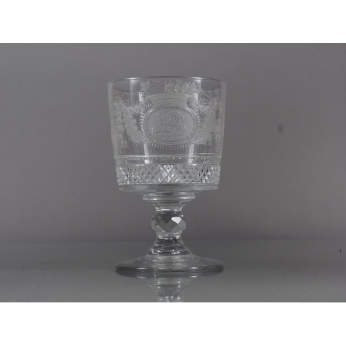 70 - An early 19th century cut and wheel engraved goblet with swags and monogram SB, 5.8